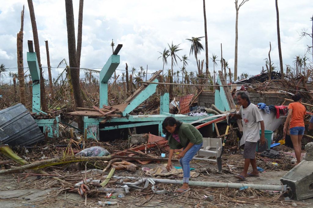 A destroyed house on the outskirts of Tacloban on Leyte island. This region was the worst affected by the typhoon, causing widespread damage and loss of life. Caritas is responding by distributing food, shelter, hygiene kits and cooking utensils. (Photo: Eoghan Rice - Trócaire / Caritas)