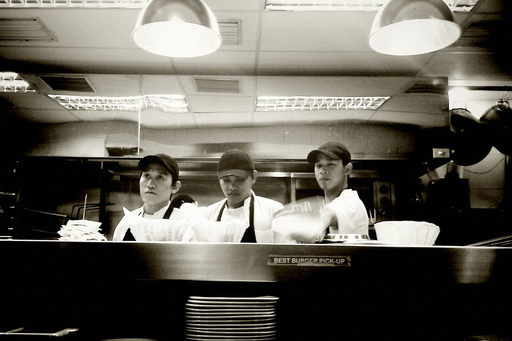 Three men cooking