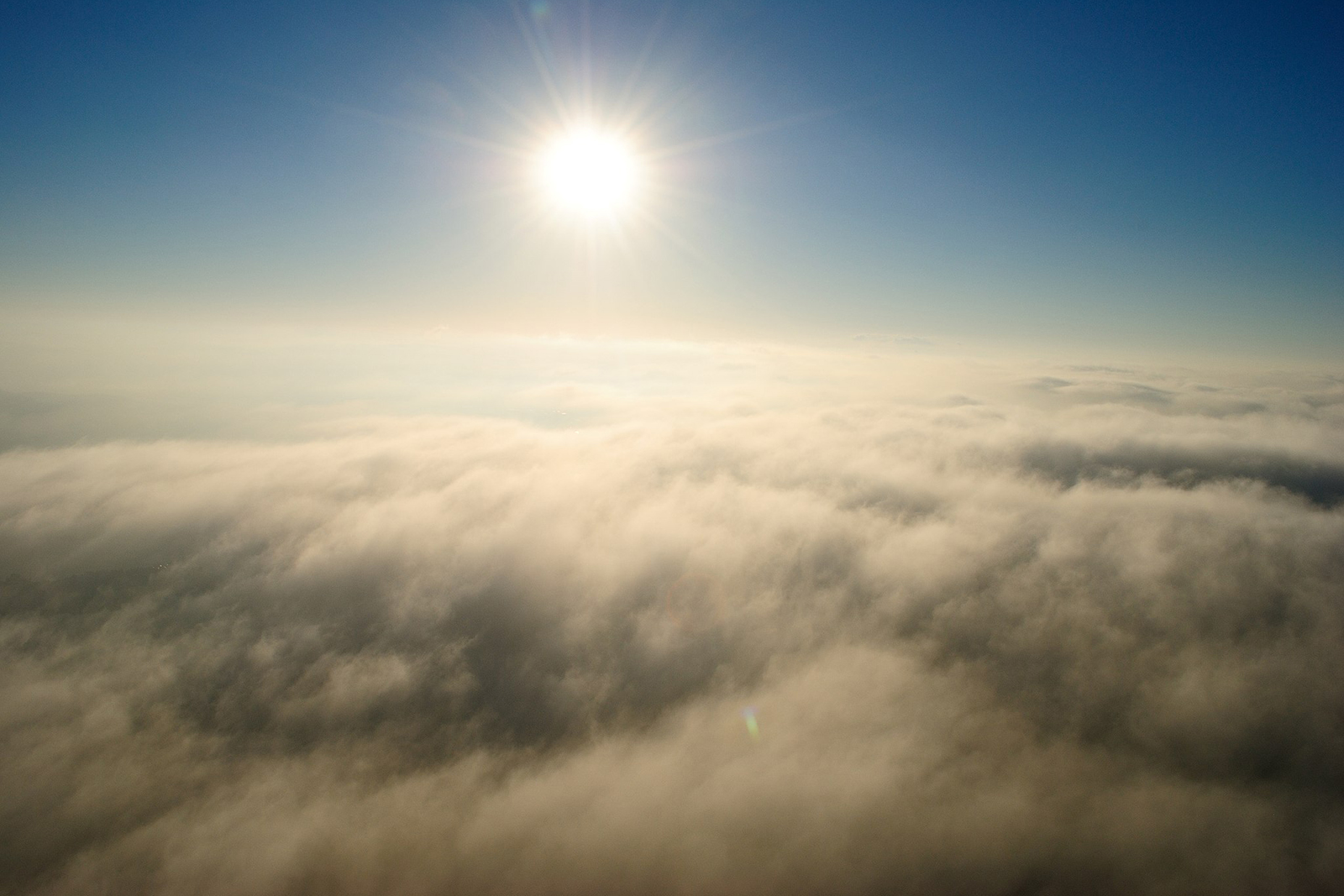 Sun over clouds over Canberra