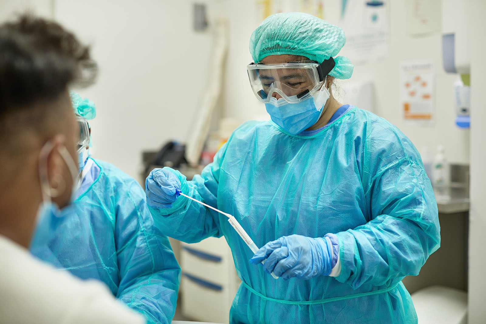 Hospital Nurse Placing Test Swab in Transport Medium