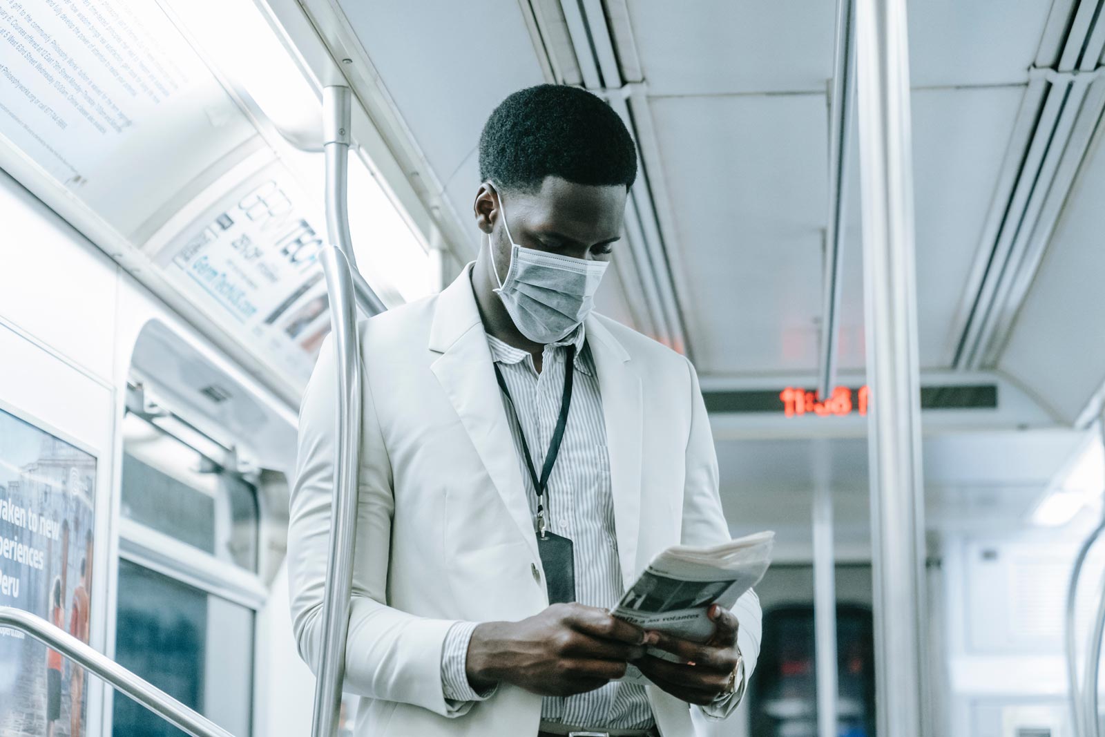 Reading Newspaper while wearing mask