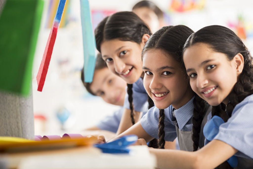 An image of 4 children in a school classroom