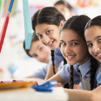 An image of 4 children in a school classroom