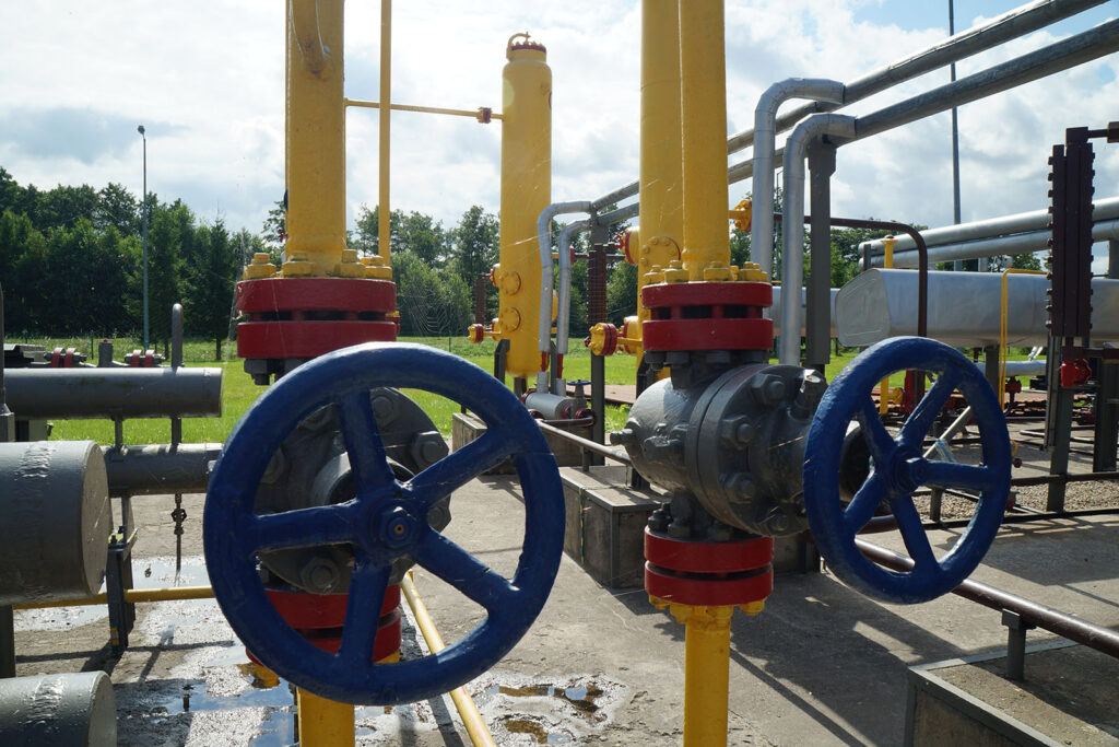 Blue turning wheel attached to yellow and white pipes