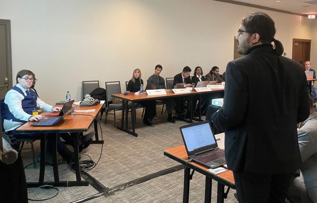 Adam Ladha addressing a room of students during the MNATO at Carleton University.