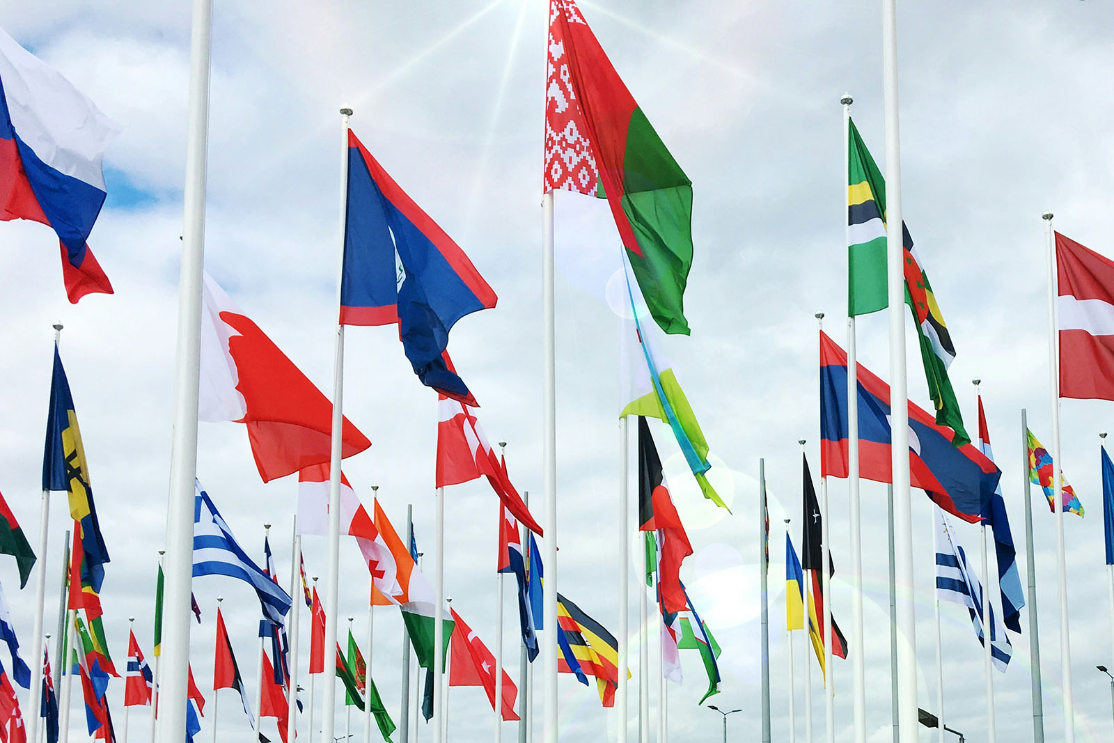 Many country flags on flag poles