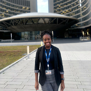 Aniska Graver standing in front of Toronto City Hall